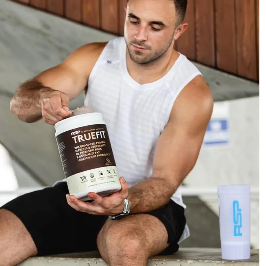 man scooping truefit out of container
